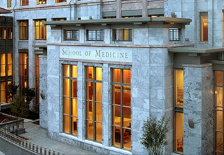 the facade of Emory's School of Medicine in the evening