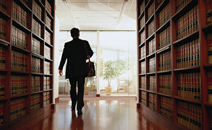 person walking through law library